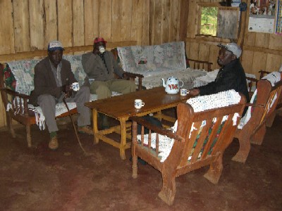 David Sitienei, Ogiek man, with friends in his home