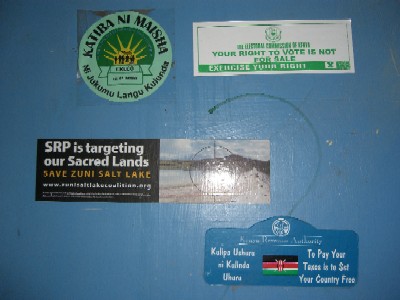 Stickers on a wall in the office of the Ogiek Welfare Council, Nakuru, Kenya